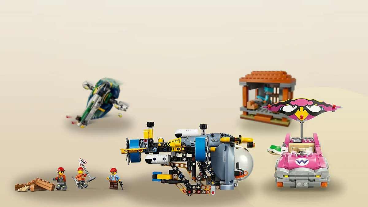 LEGO sets for 8-year-olds in one scene: the Technic submarine, Mario Kart, the yellow bulldozer and Star Wars models