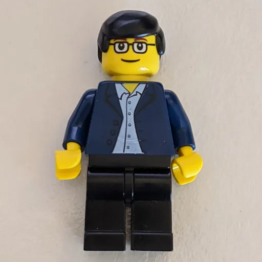 Man (Dark Blue Jacket, Black Legs, Glasses)
